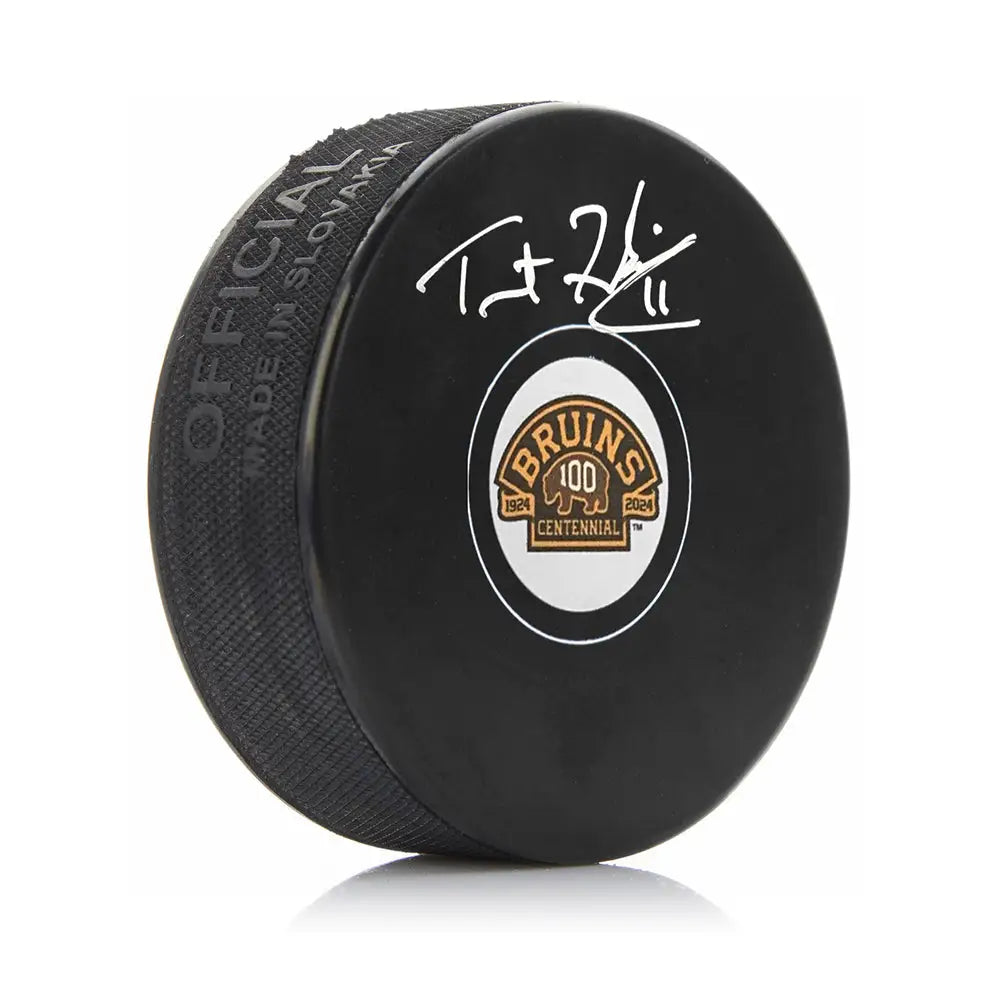 Trent Frederic Autographed Boston Bruins 100th Anniversary Hockey Logo Puck - Hockey Memorabilia